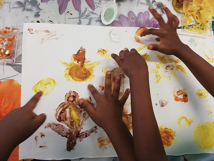 Children painting with spices